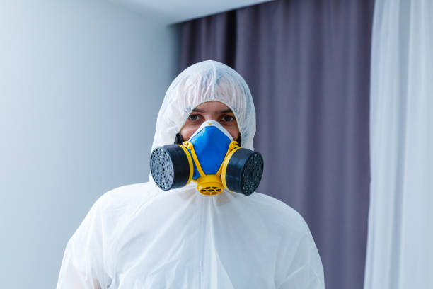 istock closeup man face in respirator and glasses 1214776571