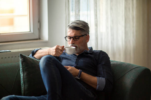 istock Thoughtful man enjoying a relaxing coffee 1214776888
