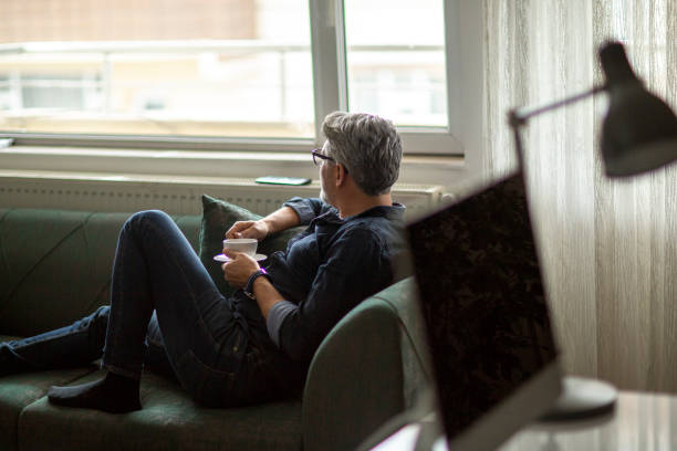 istock Thoughtful man enjoying a relaxing coffee 1214778073