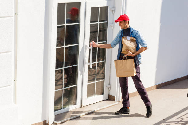 istock Man Delivering Online Grocery Order 1214779955