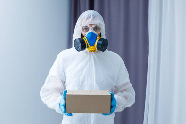 istock Man in chemical protective suit on background. Virus research 1214780351