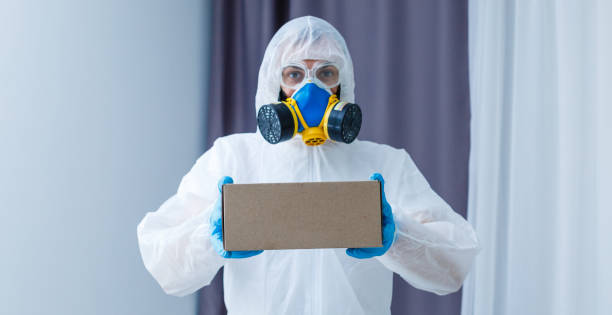 istock Man in protective suit, a mask and a respirator. 1214781139