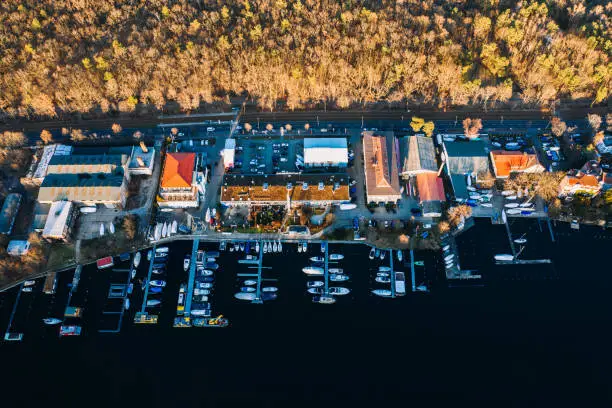 wideangle aerial sunset drone photo of the moorings stop harbor Muggelsee Berlin Friedrichshagen, Germany where the rivers Dahme and Spree connect