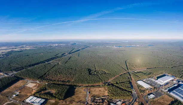 wideangle aerial drone photo with panorama of the forest of Grunheide, Berlin-Brandenburg place for the new Tesla Gigafactory Europe
