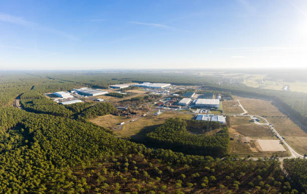 drone photo of the industrial area of Gruenheide, Berlin Brandenburg wideangle aerial drone photo with panorama of the forest of Grunheide, Berlin-Brandenburg place for the new Tesla Gigafactory Europe spree river photos stock pictures, royalty-free photos & images