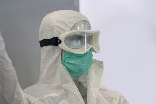 Mannequin with protective mask and spectacles with anti-inflammatory and antibacterial chemical equipment. Medicine and research