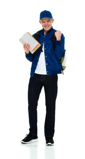 istock Teenage boys student standing wearing backpack and holding book 1214784929