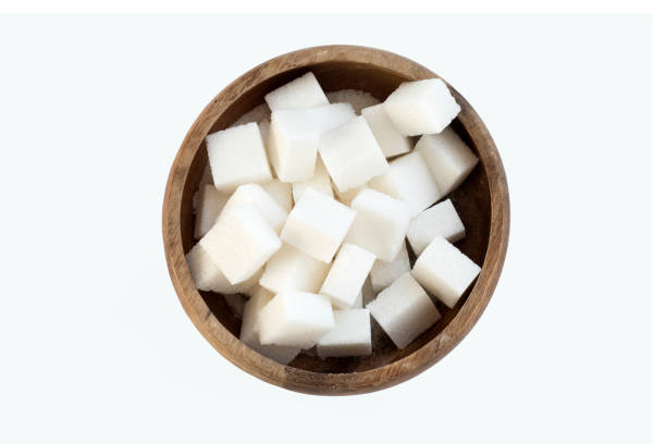 istock sugar in a bowl isolated on white background 1214786331