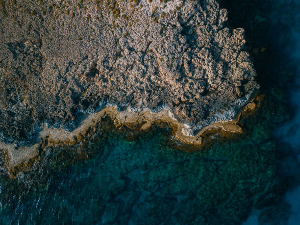 istock Waves crashing over rocks in sea 1214786373