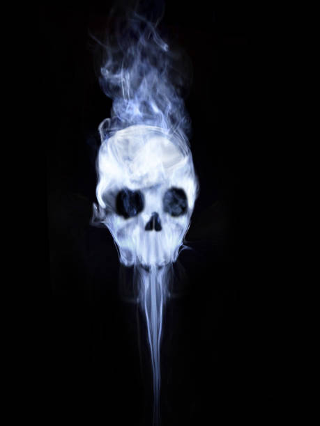 istock Tobacco smoke shaped like a skull black isolated background 1214787761