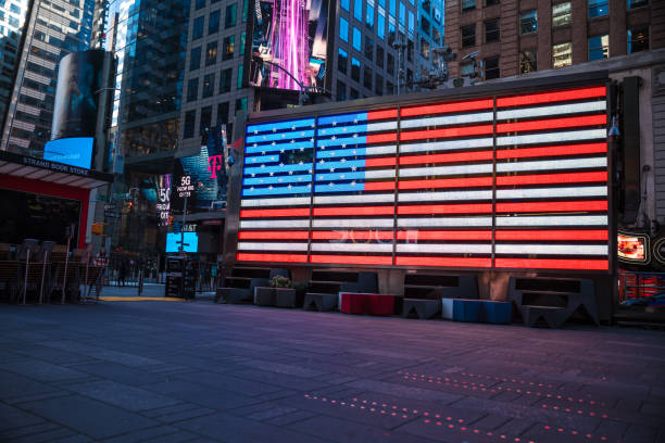 Times square New York City during 2020 current events with no people New York City, NY: 3/21/2020 The view of Times square New York City during 2020 current events with no people or hardly any people walking by. New York City comprises 5 boroughs sitting where the Hudson River meets the Atlantic Ocean. At its core is Manhattan, a densely populated borough that’s among the world’s major commercial, financial and cultural centers. Its iconic sites include skyscrapers such as the Empire State Building and sprawling Central Park. Broadway theater is staged in neon-lit Times Square. to the struggle against world terrorism statue photos stock pictures, royalty-free photos & images