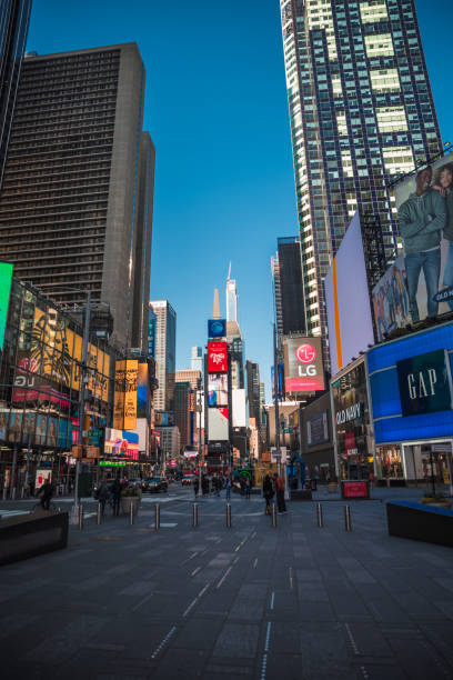 Times square New York City during 2020 current events with no people Times square New York City during 2020 current events with no people. New York City comprises 5 boroughs sitting where the Hudson River meets the Atlantic Ocean. At its core is Manhattan, a densely populated borough that’s among the world’s major commercial, financial and cultural centers. Its iconic sites include skyscrapers such as the Empire State Building and sprawling Central Park. Broadway theater is staged in neon-lit Times Square. to the struggle against world terrorism statue photos stock pictures, royalty-free photos & images