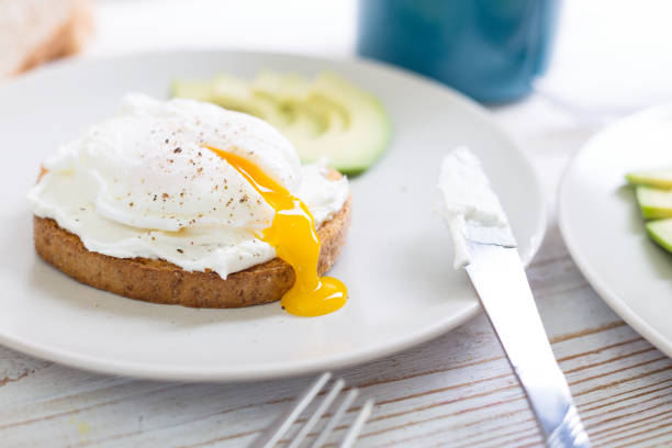 toasts with  Perfect poached eggs  at the table at the table\