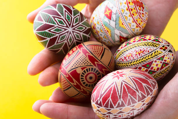 happy easter card. girl holds in hands beautiful Easter egg Pysanka handmade - ukrainian traditional \