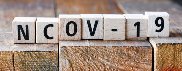 istock VIRUS word arranged from wooden letters. 1214795015