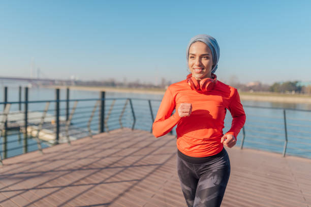 istock Attractive middle eastern woman jogging 1214796888