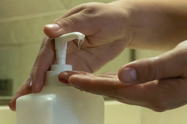 istock Washing hands with gel alcohol based hand sanitizer. 1214797390
