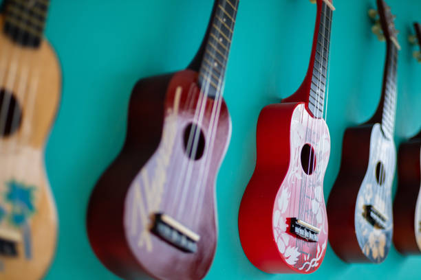 istock Small guitars on the house wall 1214804221