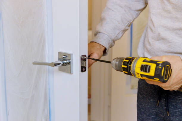 istock A man in installation a lock on a wooden door lock 1214809723