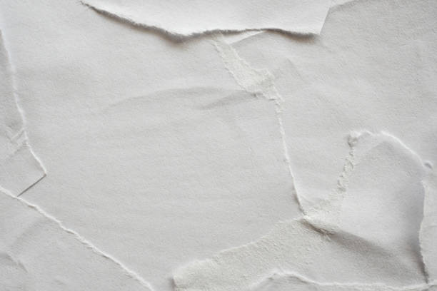 istock Blank white torn damaged paper poster texture background 1214812728
