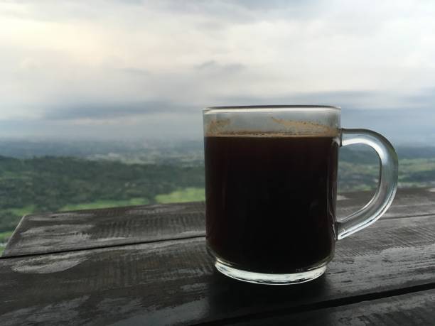 istock Coffee cup on table with the view of scenery 1214821874