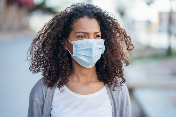 istock Woman with face protective mask 1214822046