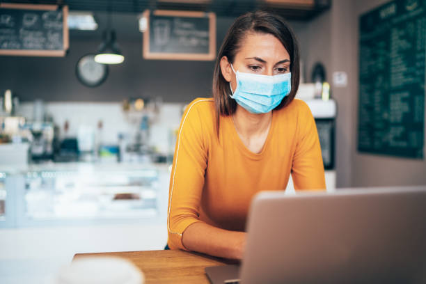 istock Woman with face protective mask 1214822047