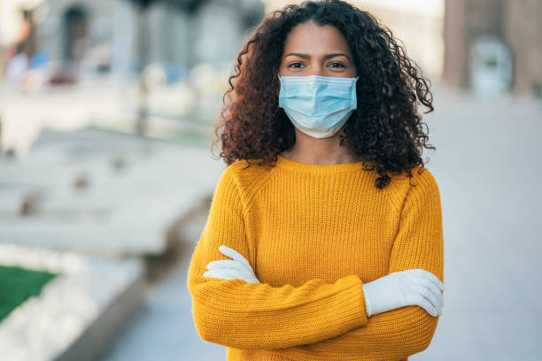 istock Woman with face protective mask 1214822050