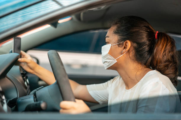 Woman setting up GPS for car trip