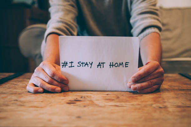 Stay Home,Stay Safe A man staying at home during coronavirus outbreak. stay at home order stock pictures, royalty-free photos & images