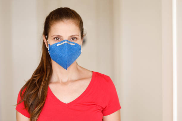 istock Redhead woman wearing mask and looking at camera 1214835171