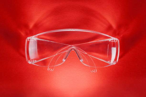 Plastic ventilated safety goggles isolated on white background