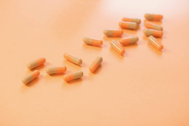 istock medicines  and pills on  orange  background 1214840252