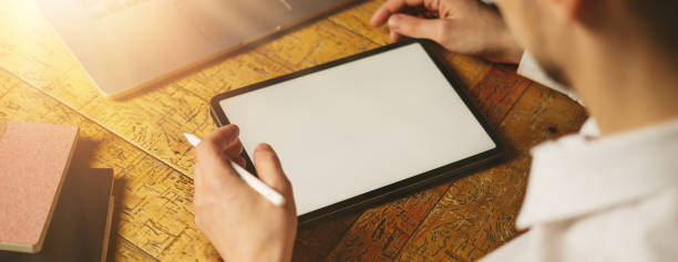 istock Closeup male hands with digital tablet. Empty blank screen. 1214845692