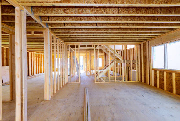 istock Building construction, wood framing new home under construction roof being built 1214847278