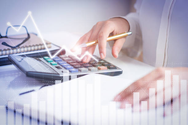istock Accountant calculating profit with financial analysis graphs 1214852535