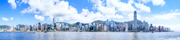 victoria harbor of hong kong - hong kong skyline panoramic china stock-fotos und bilder