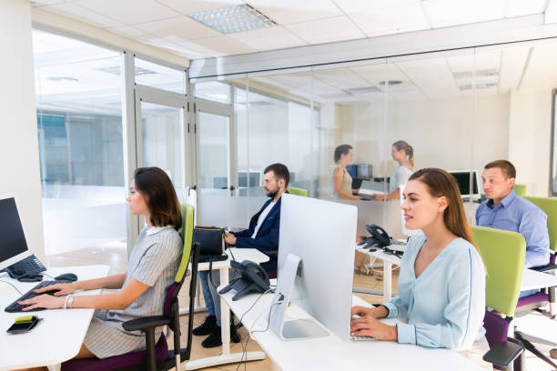 istock Group of successful business people during daily work in modern co-working space 1214864454