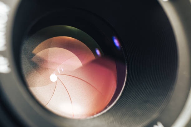 istock Beautiful camera lens with pink light of glass. Background pattern for design. 1214866746