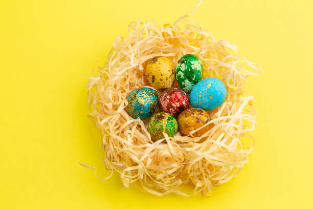 istock Painted easter eggs lie in a nest of shavings 1214868651