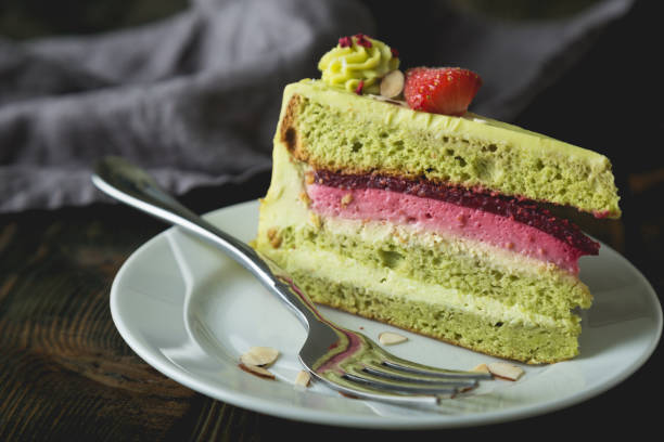 istock A piece of green cake on the table 1214870093