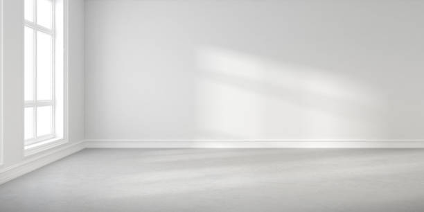 istock Abstract of empty white concrete room with sun light cast the window shadow on the wall and floor,Perspective of minimal design architecture. 3d render. 1214871245
