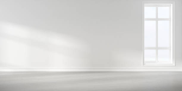 istock Abstract of empty white concrete room with sun light cast the window shadow on the wall and floor,Perspective of minimal design architecture. 3d render. 1214871278