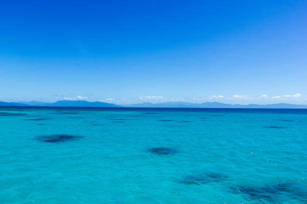 istock beautiful great barrier reef with white clouds on a sunny day, cairns, australia 1214879738