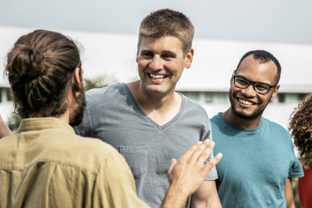 istock Happy multiracial people talking outdoors 1214881983