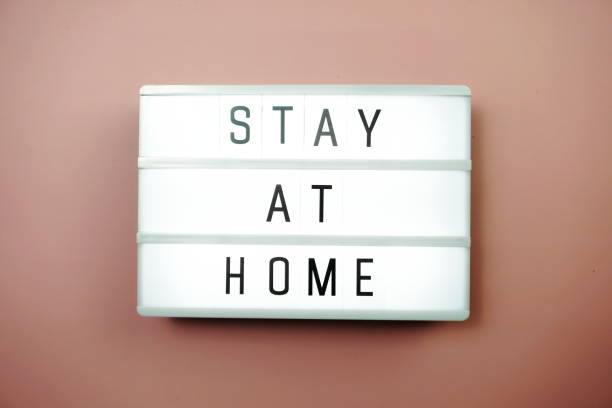 istock Stay at Home word letter in light box on pink background 1214882739