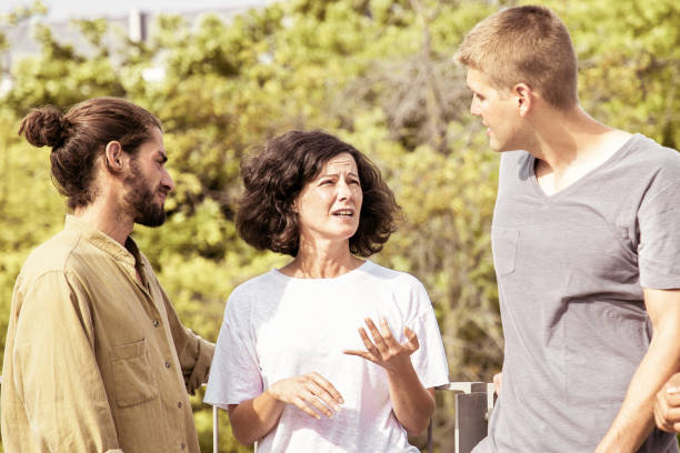 istock Serious multiracial people talking outdoors 1214882803