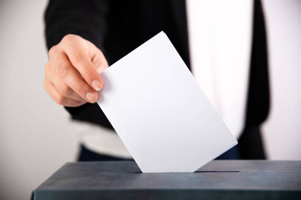istock Woman votes on election day. 1214885006