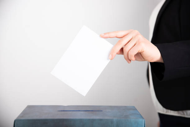 istock Woman votes on election day. 1214885039