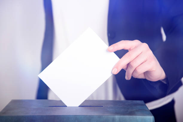istock Woman votes on election day. 1214885068